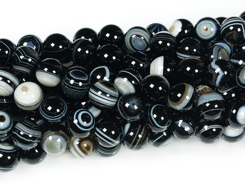 Глазковые кварцы. Черный глазковый агат камень. Глазчатый агат. Черный глазковый агат камень. Глазковые агаты.